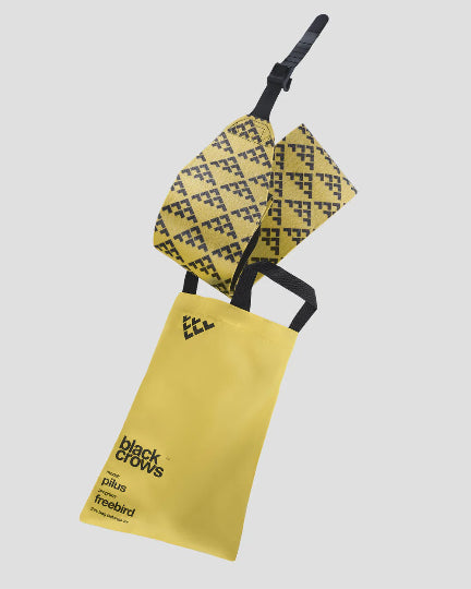Yellow bag with black geometric patterns and text on a white background
