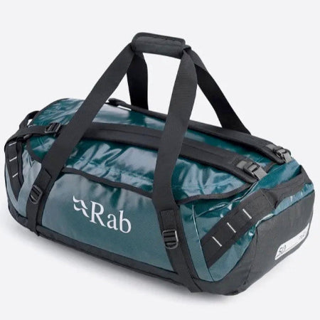 A blue and black heavy-duty kitbag with a brand logo 'rab' on the side, featuring a main opening, zippered closure, and multiple handles.