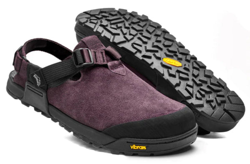 Purple clog shoe with black sole on a white background