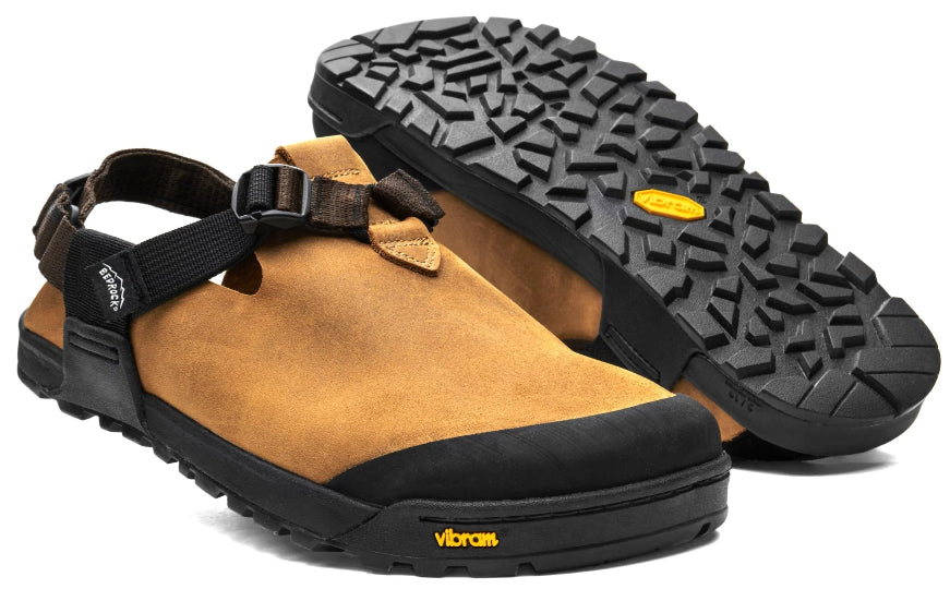 Brown clog with black sole and Vibram logo on a white background