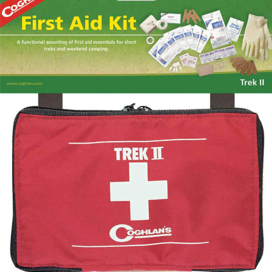 A red and white Trek II first aid kit by Coghlans, with various bandages and first aid items visible in compartments, packaged for retail sale.