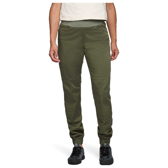 Person wearing olive green pants on a white background