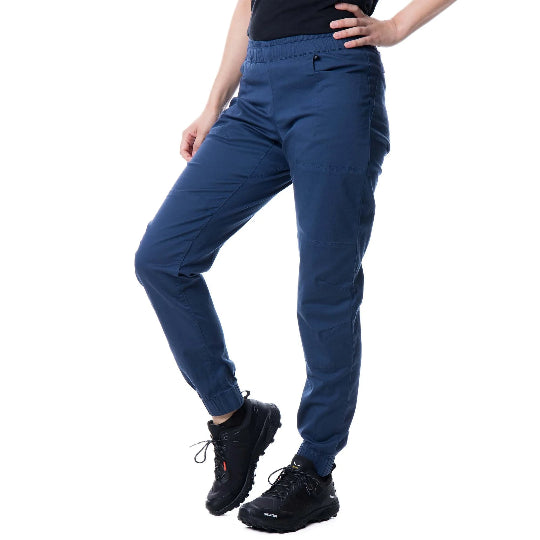 Person wearing blue pants and black shoes on a white background