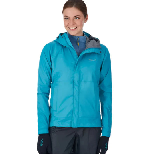 Person wearing a blue jacket with a visible brand logo on a white background
