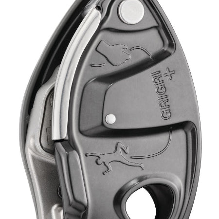 A black Grigri+ belay device used for climbing, showing the device's cam-assisted blocking and anti-panic handle.