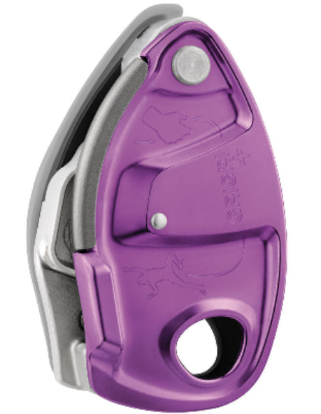 A purple Grigri+ belay device used for climbing, showing the device's cam-assisted blocking and anti-panic handle.