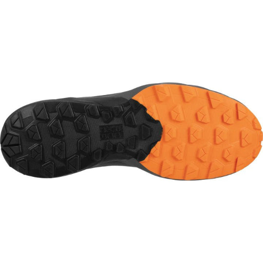 Orange and black sole of a running shoe on a white background