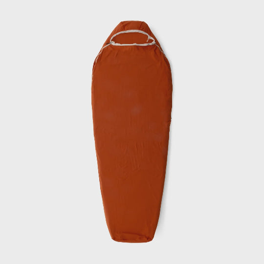 Brown sleeping bag on a light gray background