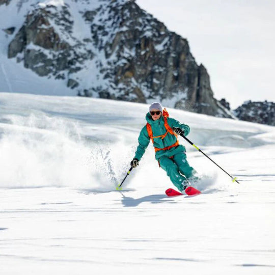 Person skiing in a snowy mountain landscape