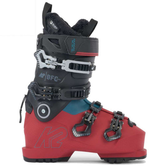 Red and black ski boot with visible branding on a white background