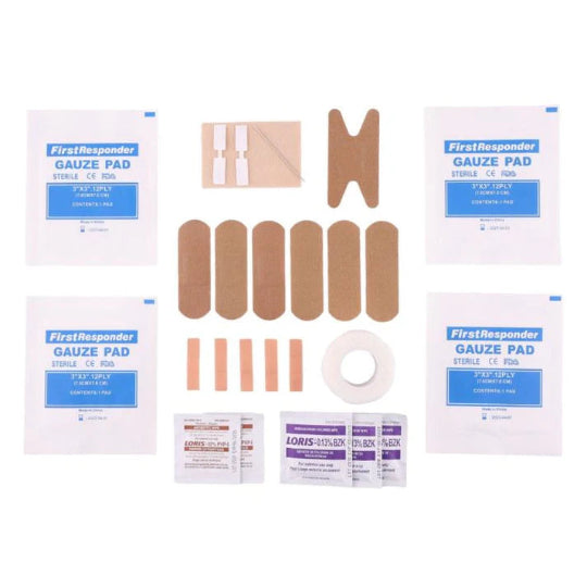 Collection of bandages and gauze pads on a white background
