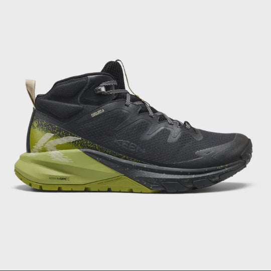 Black and green hiking shoe on a light gray background
