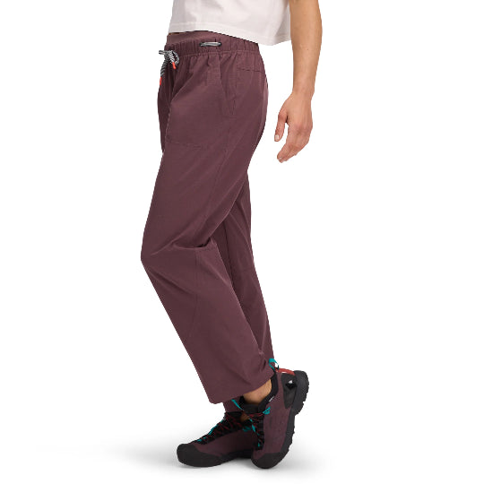 Maroon pants worn by a person on a white background