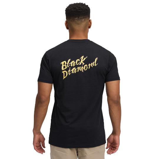 Person wearing a black t-shirt with 'Black Diamond' text on the back, on a white background