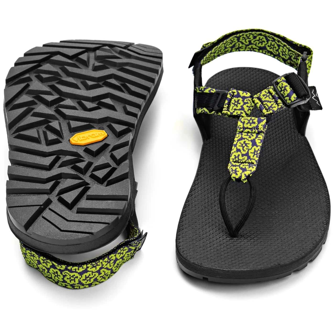 Black sandal with yellow flower pattern on a white background