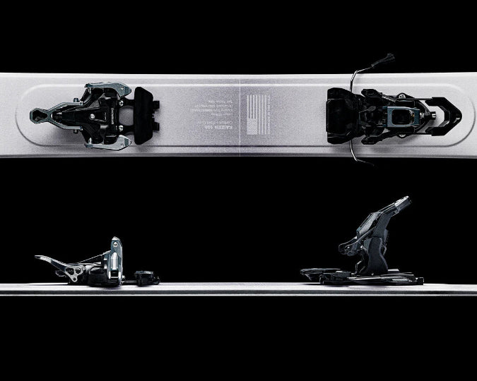 Close-up of a ski with bindings on a black background