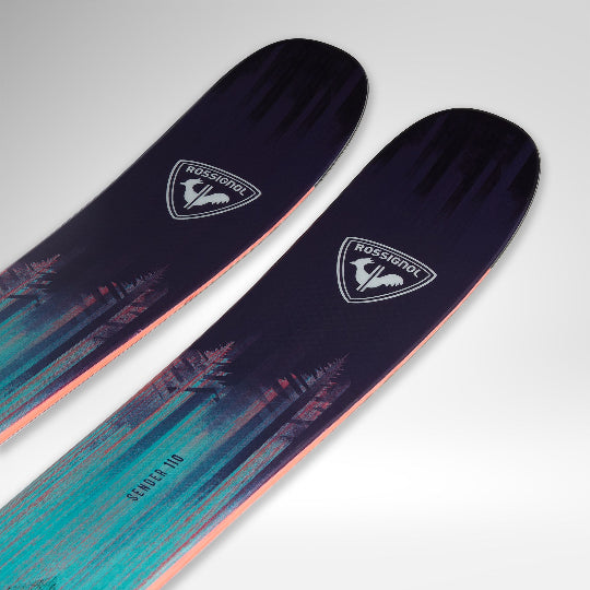 Two Rossignol skis with a gradient design on a light gray background