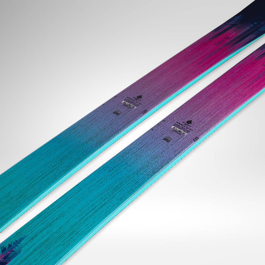 Two skis with a gradient color pattern on a white background