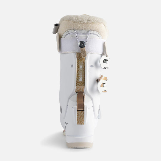 White ski boot with beige fur lining on a white background