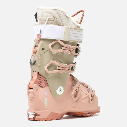 Pink and beige ski boot with 'Rossignol' branding on a white background