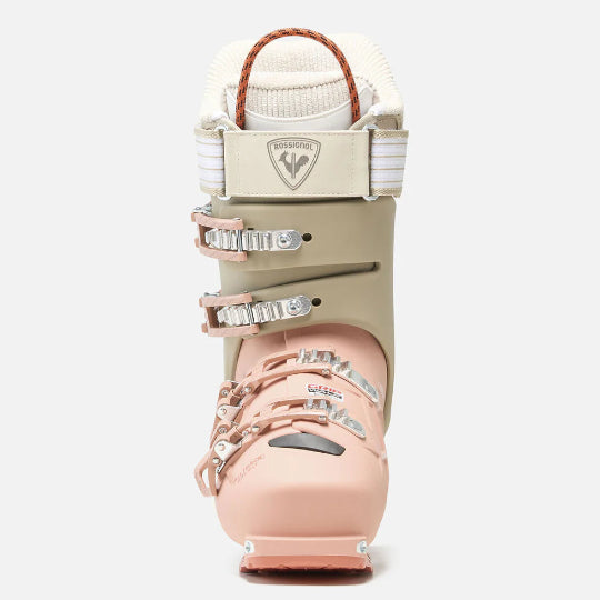 Pink and beige ski boot with visible brand logo on a white background