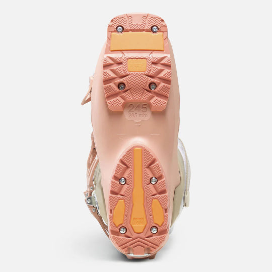 Close-up of a pink and beige shoe sole on a white background