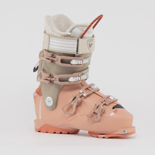 Multicolored ski boot with beige, peach and white design on a white background
