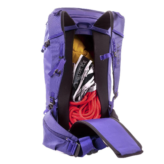 Purple backpack with climbing gear inside on a white background
