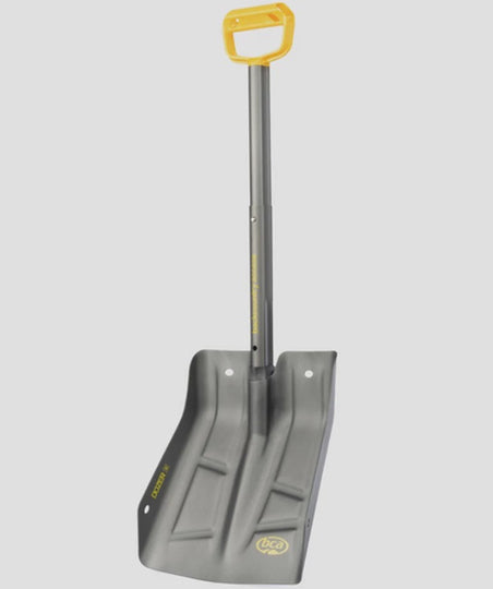 Gray snow shovel with a yellow handle on a white background