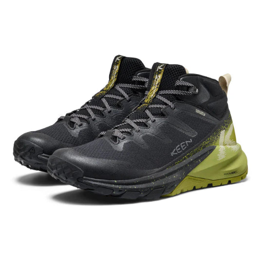 Black and green KEEN hiking shoes on a white background
