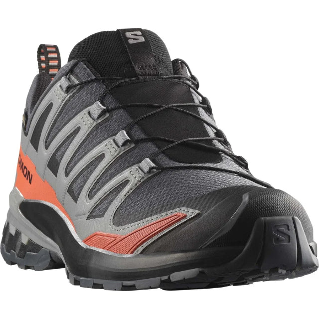 Gray and black hiking shoe with orange accents on a white background