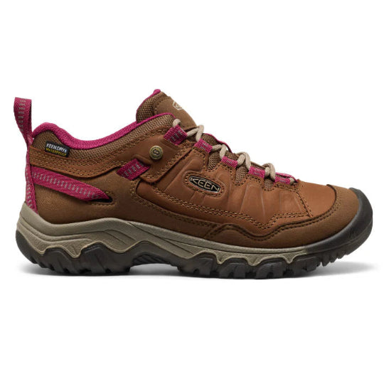 Brown hiking shoe with pink accents on a white background