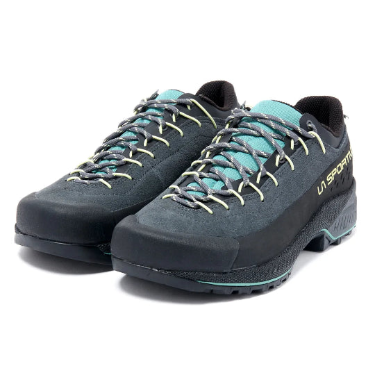A pair of La Sportiva hiking shoes in dark gray and black with turquoise accents on the laces, lining, and midsole, shown against a plain white background.