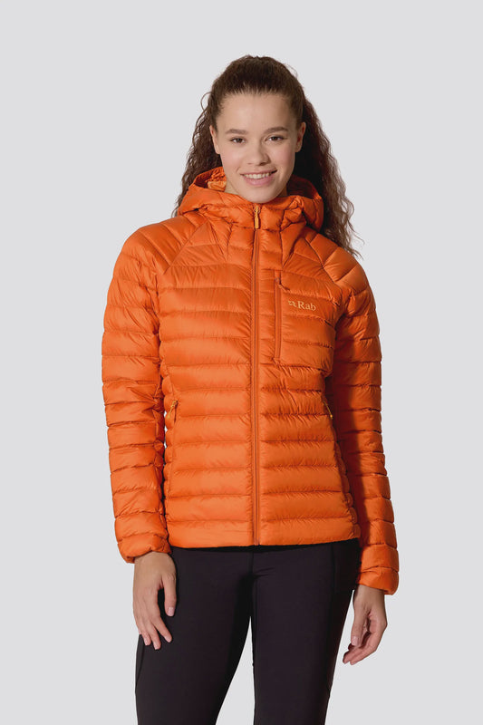 Woman wearing an orange down puffer jacket